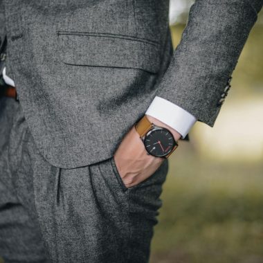 Man Wearing Watch With Hand on Pocket