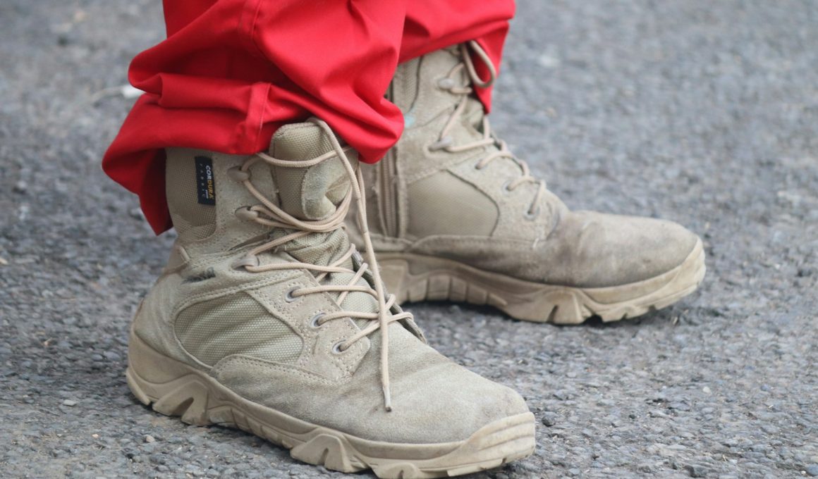 person in red pants and brown leather lace up boots