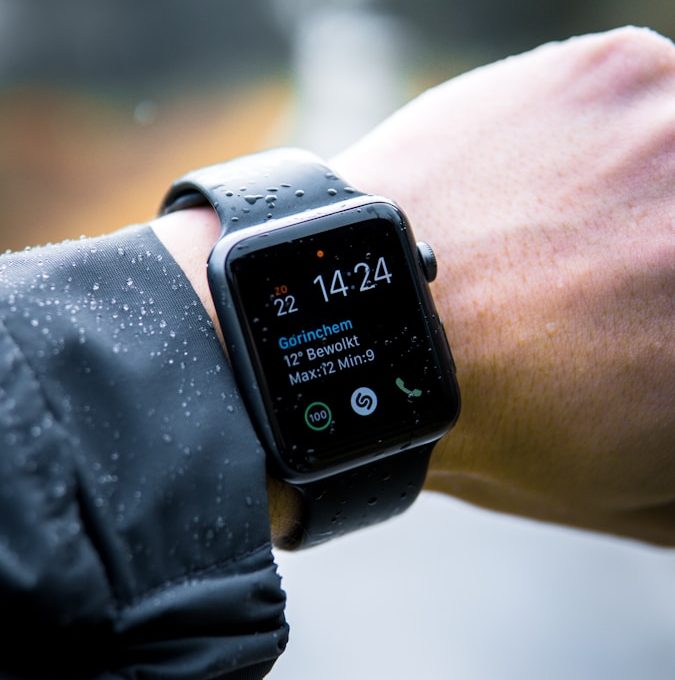 person wearing Apple Watch at 14:24