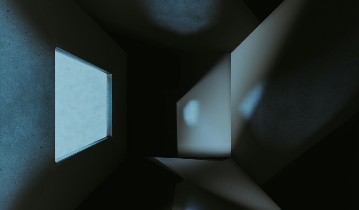a dark room with a small window in it