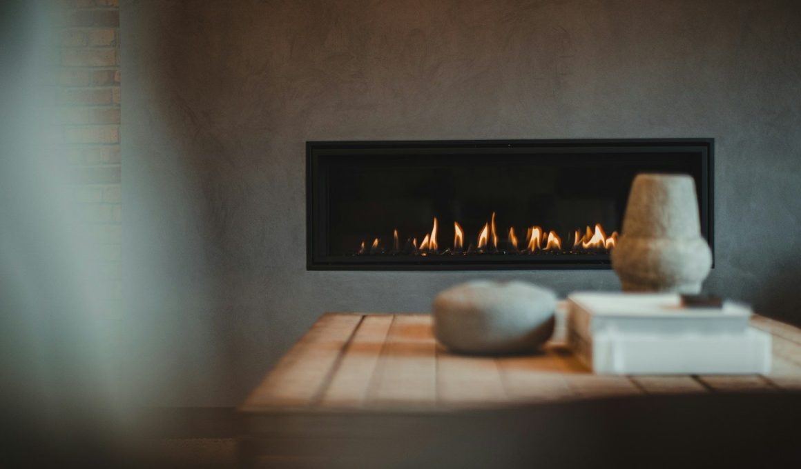 a table with a vase and a fire place on it