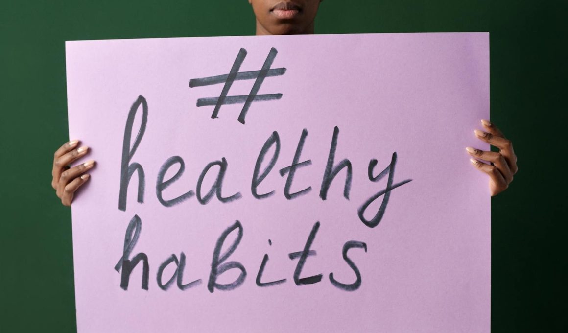 Person holding a "#healthyhabits" sign, emphasizing wellness.