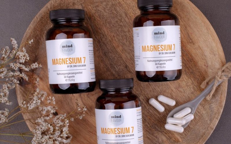 three bottles of magnesum on a wooden plate