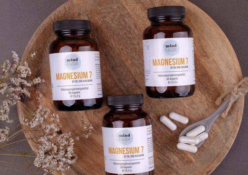 three bottles of magnesum on a wooden plate