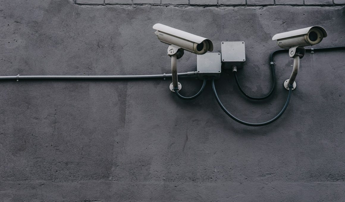 two bullet surveillance cameras attached on wall