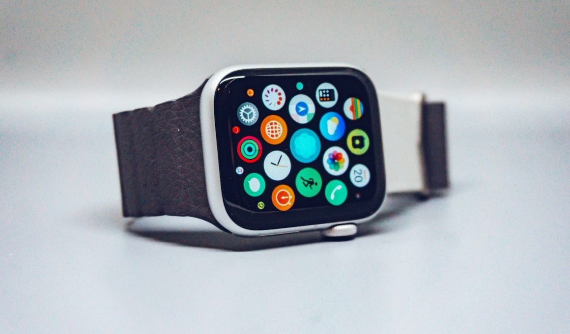 A smartwatch with a dark textured band and a colorful app icon display