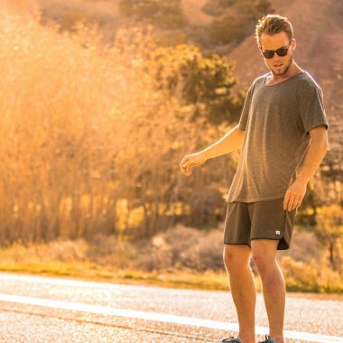 man in gray crew neck t-shirt running on road during daytime